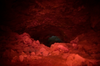 Bear trap cave lava tube with red and blue light